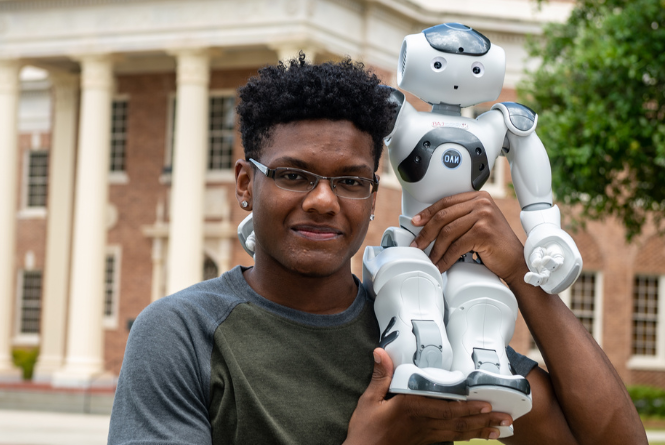 USM Student with ADA the Robot